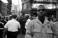 <p>Law enforcement standing by after a fight broke out during a protest outside of the convention. (Photo: Khue Bui for Yahoo News)</p>