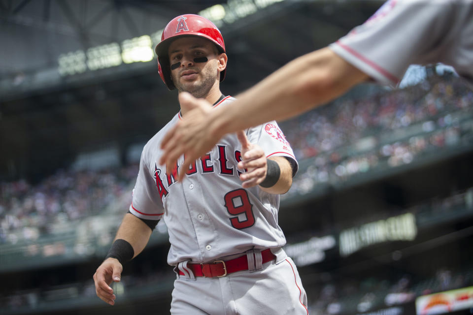 SEATTLE, WA - JUNE 02:  Tommy La Stella #9 of the Los Angeles Angels of Anaheim scores on a wild pitch by Connor Sadzeck #54 of the Seattle Mariners in the fifth inning at T-Mobile Park on June 2, 2019 in Seattle, Washington. (Photo by Lindsey Wasson/Getty Images)