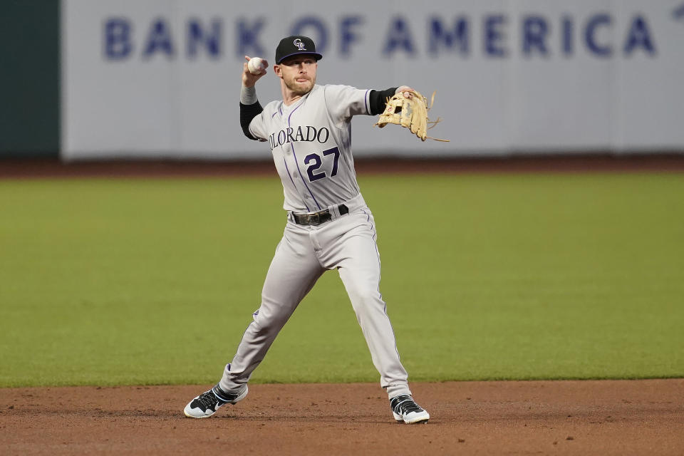 Colorado Rockies shortstop Trevor Story throws out San Francisco Giants' Wilmer Flores during the first inning of a baseball game in San Francisco, Tuesday, Sept. 22, 2020. (AP Photo/Jeff Chiu)