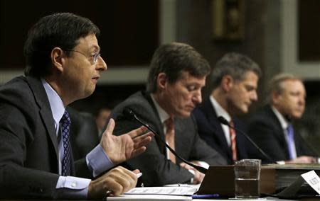 (L-R) Credit Suisse legal consul Romeo Cerutti, Credit Suisse officials CEO Brady Dougan, Robert Shafir and Hans Urlich-Mesiter testify before the Senate Homeland and Governmental Affairs Investigations Subcommittee on Capitol Hill in Washington February 26, 2014. REUTERS/Gary Cameron