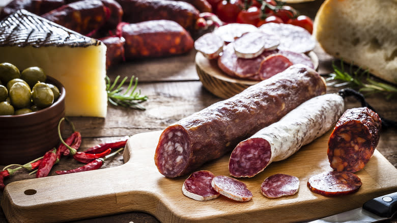 cured sausage on cutting board