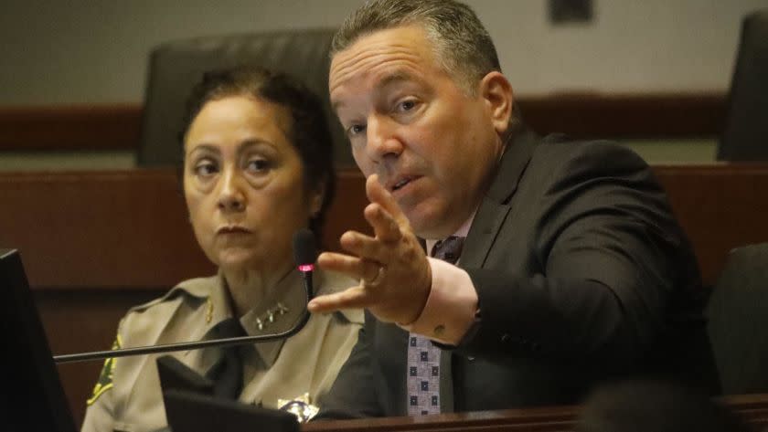 LOS ANGELES, CA - MARCH 26, 2019 - - Sheriff Alex Villanueva, right, addresses the issue of Secret Deputy Sub-groups as new Assistant Sheriff Robin Limon looks on during the Sheriff Civilian Oversight Commission at the Metropolitan Transit Authority in Los Angeles on March 26, 2019. "My job is to strike a careful balance," Villanueva said. ""Our job is public safety," he concluded. In a letter last week, the COC criticized Sheriff Villanueva, saying the department has engaged in "dissembling and stonewalling" when it comes to handing over documents related to cliques. The meeting comes at a time when Villanueva is facing criticism from several fronts, including from the Board of Supervisors, which went to court to try to stop him from reinstating a fired deputy. (Genaro Molina/Los Angeles Times)