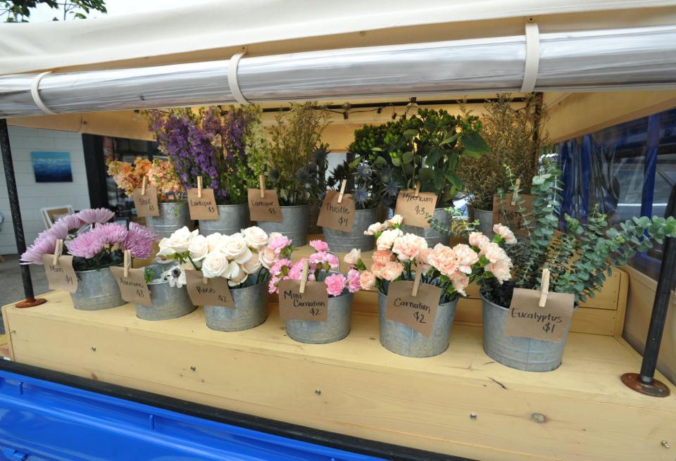 Various flowers are offered to customers create their own bouquets in The Petal Bar flower truck owned by Megh Burgess, of Duxbury, during an event at Thacher & Spring in Hingham on Thursday, June 16, 2022.