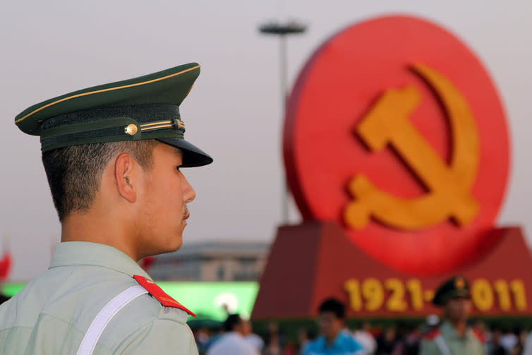 <span class="caption">China: looking on.</span> <span class="attribution"><a class="link " href="https://www.shutterstock.com/pic-171104741/stock-photo-beijing-july-3-a-soldier-stands-guard-at-the-tiananmen-square-in-beijing-china-in-july-2011-the-chinese-people-celebrated-the-ninety-years-since-the-founding-of-the-communist-party-o.html?src=m6XTNamZLuk6IiFXeDRaJw-1-71" rel="nofollow noopener" target="_blank" data-ylk="slk:Shutterstock;elm:context_link;itc:0;sec:content-canvas">Shutterstock</a></span>