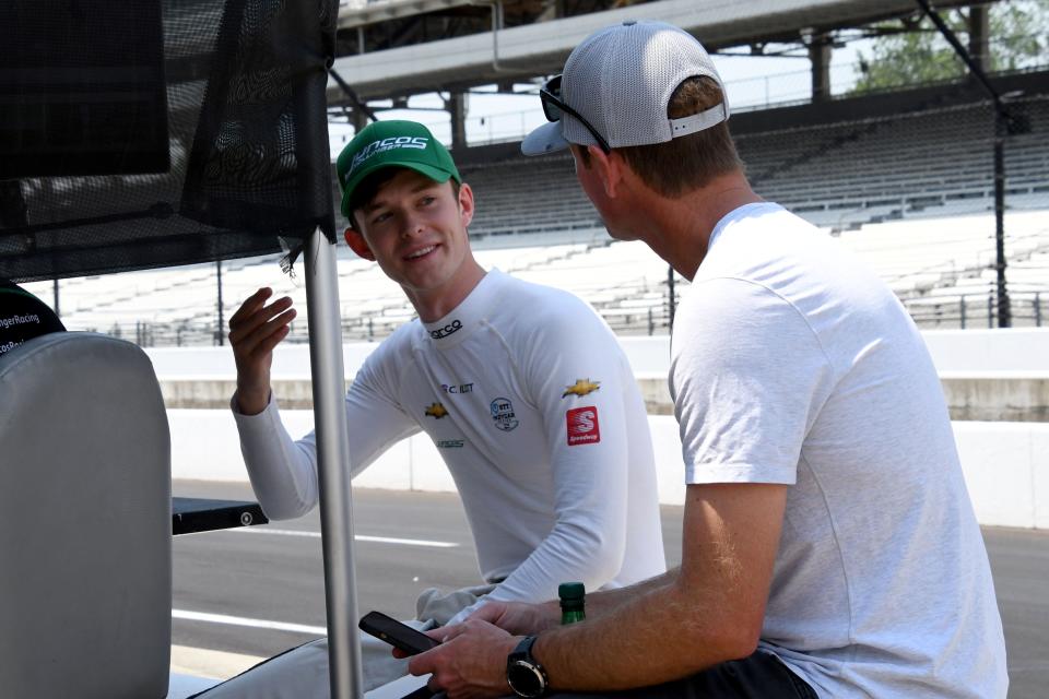 Juncos Hollinger Racing driver Callum Ilott (77) talks with Ryan Hunter-Reay on Friday, May 20, 2022, during Fast Friday practice in preparation for the 106th running of the Indianapolis 500 at Indianapolis Motor Speedway