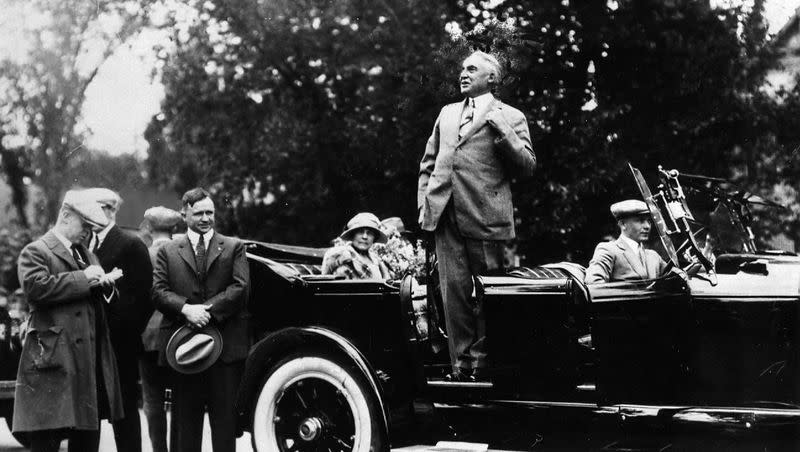 President Warren G. Harding address a large crowd at Liberty Park in Salt Lake City on June 26, 1923. Gov. Charles Mabey stands at the rear of the automobile.