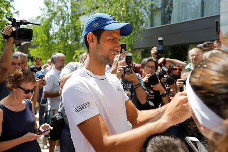 Novak Djokovic of Serbia signs autographs after a training session in Belgrade, Serbia, May 2, 2018. REUTERS/Marko Djurica