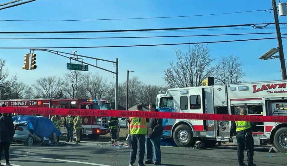 Two people in a car died in a collision Wednesday morning between their vehicle and a fire truck at White Horse Pike and Warwick Road in Magnolia.