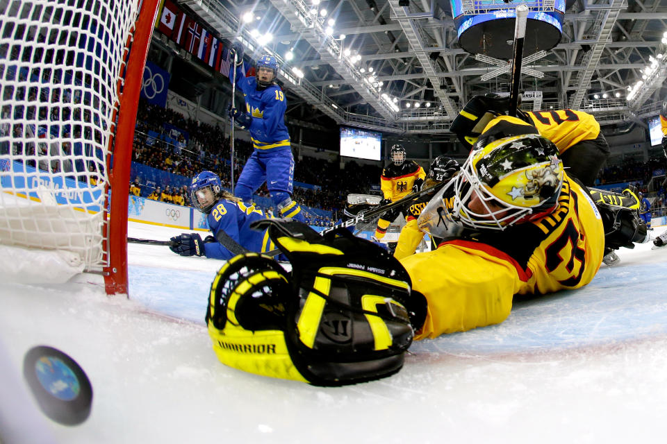 Michelle Lowenhielm #28 of Sweden scores their third goal against Jennifer Harss #30 of Germany in the third period during the Women's Ice Hockey Preliminary Round Group B game during the Sochi 2014 Winter Olympics at Shayba Arena on February 11, 2014 in Sochi, Russia.