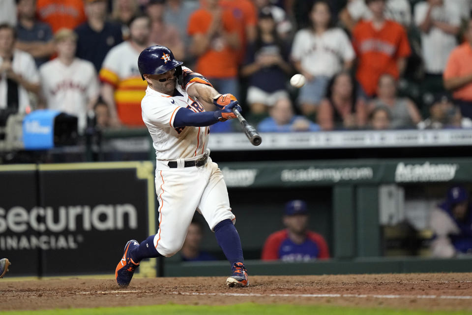 Houston Astros' Jose Altuve hits a game-winning grand slam during the 10th inning of a baseball game against the Texas Rangers Tuesday, June 15, 2021, in Houston. The Astros won 6-3. (AP Photo/David J. Phillip)