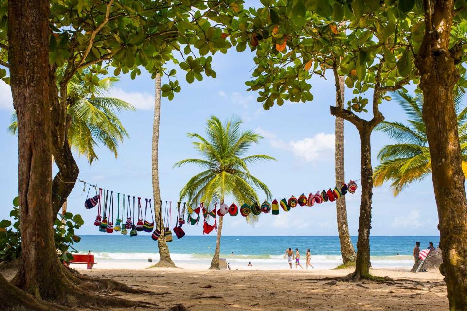 Local people and tourists take a bath, sunbath or relax at Maracas Bay in Port of Spain, Trinidad And Tobago.