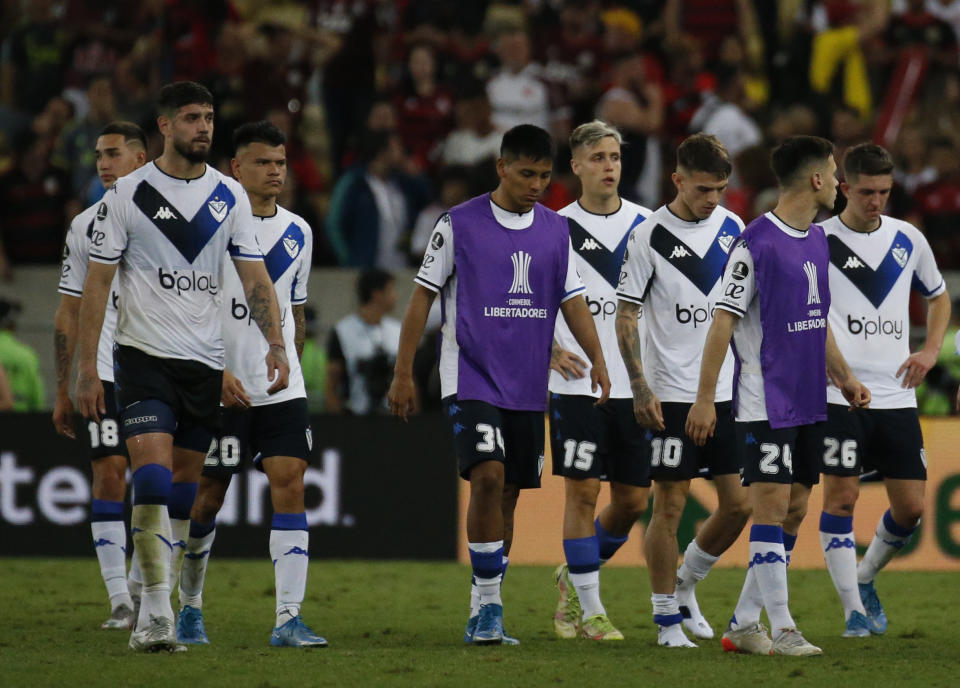 Players of Argentina's Velez Sarsfield leave the field after losing 2-1 against Brazil's Flamengo at the end of a Copa Libertadores semifinal second leg soccer match at Maracana stadium in Rio de Janeiro, Brazil, Wednesday, Sept. 7, 2022. Brazil's Flamengo qualified to the final. (AP Photo/Bruna Prado)