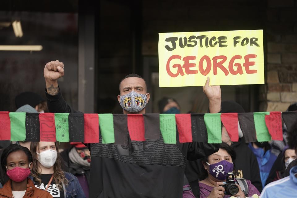 People celebrate outside Cup Foods in Minneapolis, Tuesday, April 20, 2021, after the guilty verdicts were announced in the murder trial against former Minneapolis police Officer Derek Chauvin in the killing of George Floyd. (AP Photo/Morry Gash)