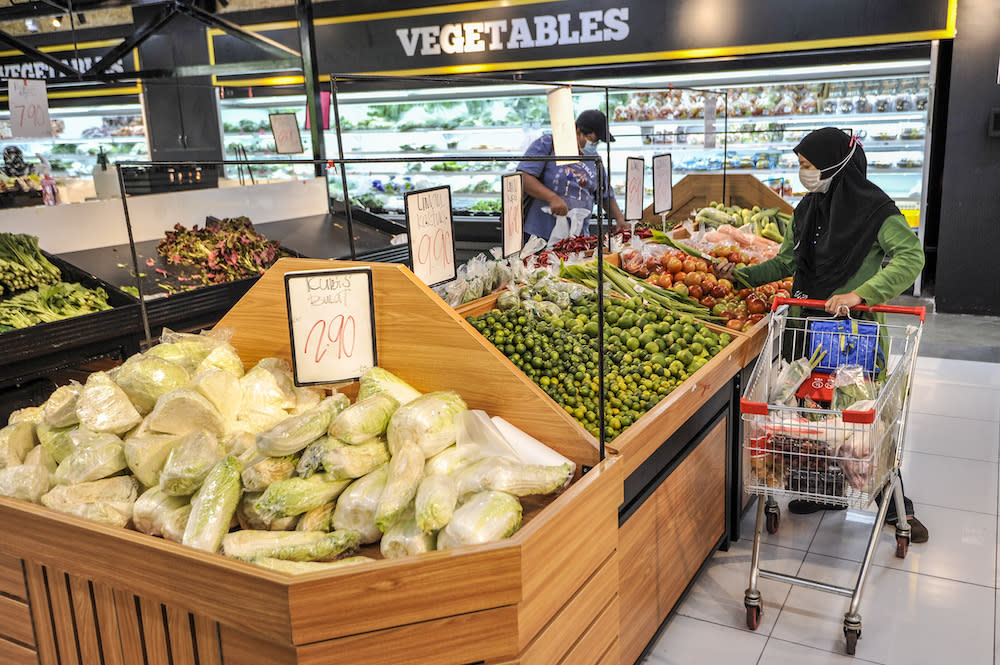 File picture of a customer buying groceries at a supermarket in Cyberjaya April 5, 2020. — Picture by Shafwan Zaidon