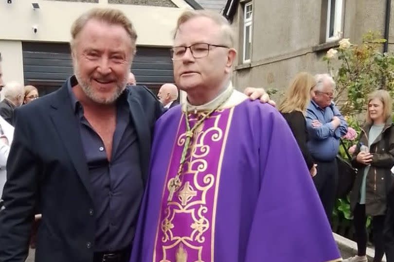 Bishop Pat Buckley pictured with Michael Flatley at the funeral of Seamus Tansey in 2022