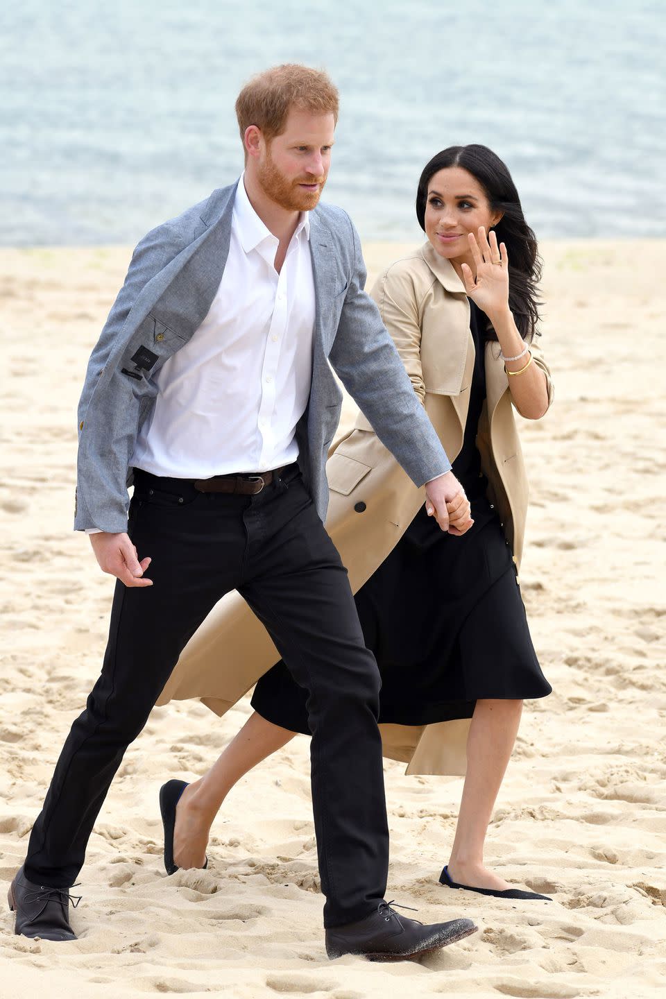 <p><strong>October 2018</strong> Meghan Markle wore a Dion Lee dress underneath a beige coat on a visit to Melbourne beach.</p>