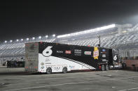 Ryan Newman's hauler remains in the garage area after he was taken to the hospital when he was injured in a crash on the final lap of the NASCAR Daytona 500 auto race at Daytona International Speedway, Monday, Feb. 17, 2020, in Daytona Beach, Fla. Sunday's race was postponed because of rain. (AP Photo/Phelan M. Ebenhack)