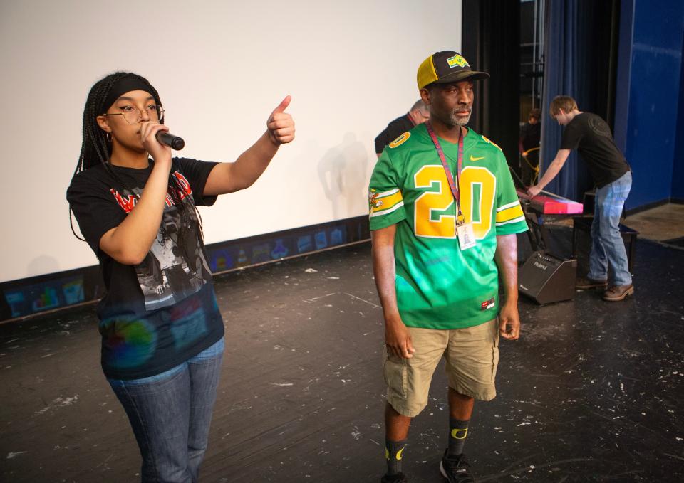 Student Nyla Mennenea, left, and teacher Gene Chism do a mic check before the Black Excellence Week Assembly at Churchill High School Feb 22, 2024 in Eugene.