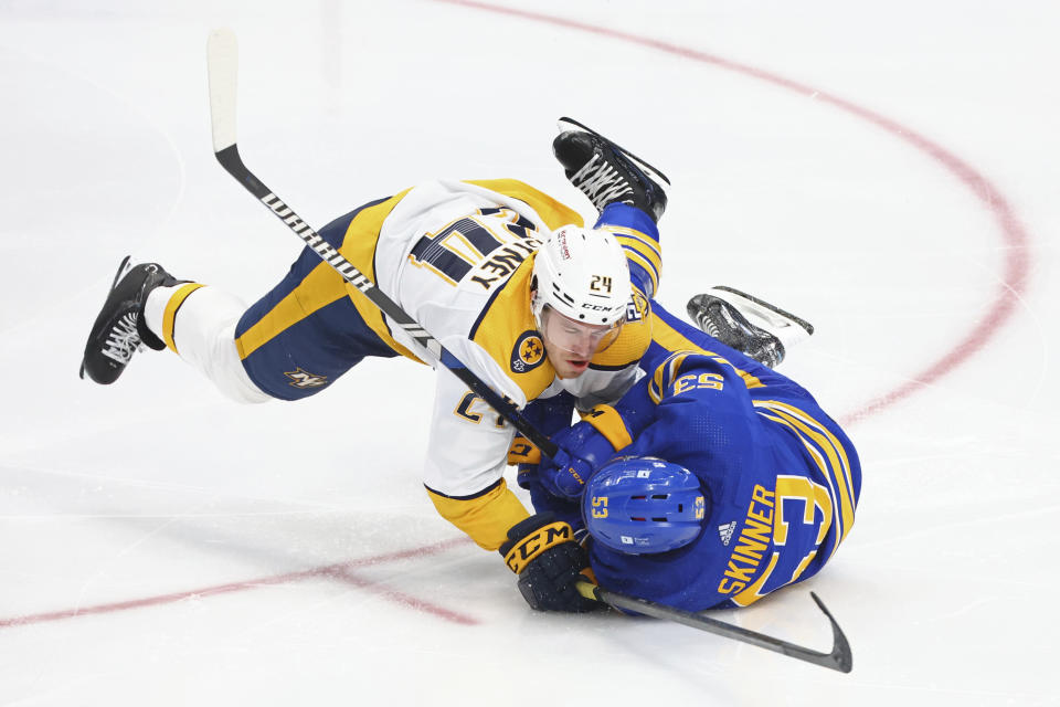 Buffalo Sabres left wing Jeff Skinner (53) is brought down by Nashville Predators defenseman Spencer Stastney (24) during the third period of an NHL hockey game Sunday, Dec. 3, 2023, in Buffalo, N.Y. (AP Photo/Jeffrey T. Barnes)