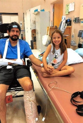 Christopher Dugan and his daughter, Olivia. Dugan was seriously injured in 2017 when his motorcycle was hit by a Tesla employee driving a company truck on Rockville Road.