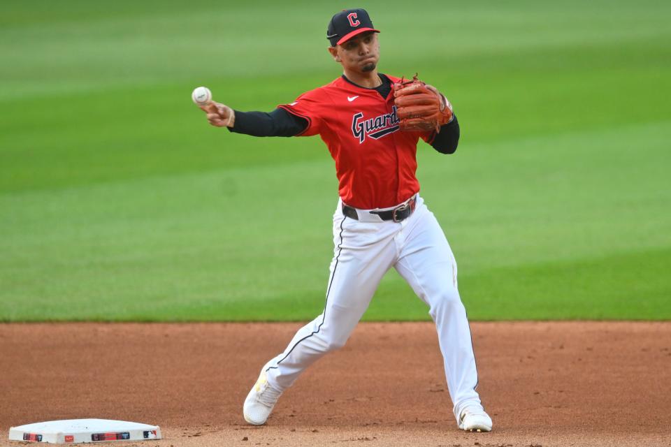 Aug 5, 2024; Cleveland, Ohio, USA; Cleveland Guardians second baseman Andres Gimenez (0) turns a double play in the first inning against the Arizona Diamondbacks at Progressive Field. Mandatory Credit: David Richard-USA TODAY Sports