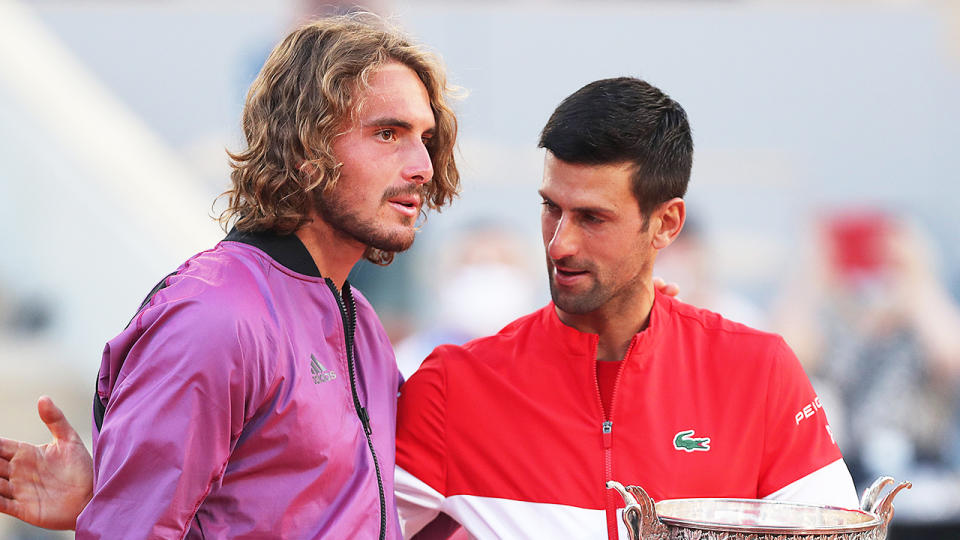 Stefanos Tsitsipas (pictured left) being embraced by Novak Djokovic (pictured right) after the Roland Garros final.