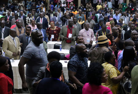 Delegates celebrate after Zimbabwean President Robert Mugabe was dismissed as party leader at an extraordinary meeting of the ruling ZANU-PF's central committee in Harare, Zimbabwe November 19, 2017. REUTERS/Philimon Bulawayo