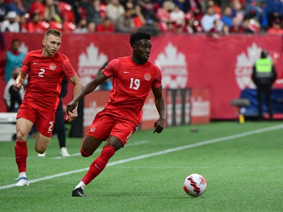 Canada's Alphonso Davies controls the ball during a match against Curacao in June at B.C. Place in Vancouver. The stadium was chosen alongside Toronto's BMO Field as one of two Canadian host sites for the 2026 World Cup. (Don MacKinnon/AFP via Getty Images - image credit)