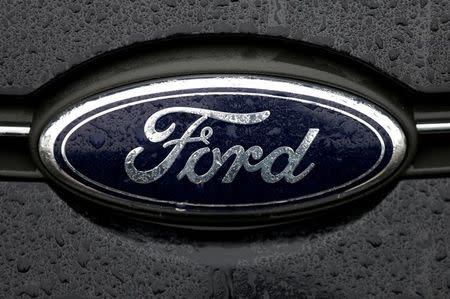 FILE PHOTO - The Ford logo is pictured at the Ford Motor Co plant in Genk,Belgium December 17, 2014. REUTERS/Francois Lenoir/File Photo