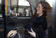 Rebekah Brooks, former News International chief executive leaves the Central Criminal Court in London where she appeared to face charges related to phone hacking, Wednesday, Feb. 19, 2014. Jurors at Britain's phone-hacking trial were told Wednesday that former Prime Minister Tony Blair allegedly offered to work as an unofficial adviser to Rupert Murdoch as revelations of illegal phone hacking engulfed the mogul's media empire. (AP Photo/Sang Tan)