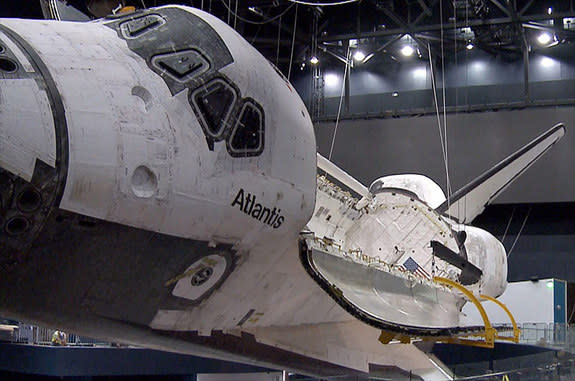 Space shuttle Atlantis' payload bay has been opened as part of the preparations for the retired orbiter's June 29, 2013 debut on public display at the Kennedy Space Center Visitor Complex in Florida.