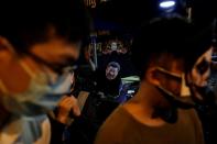 FILE PHOTO: Anti-government protesters wearing costumes march during Halloween in Hong Kong