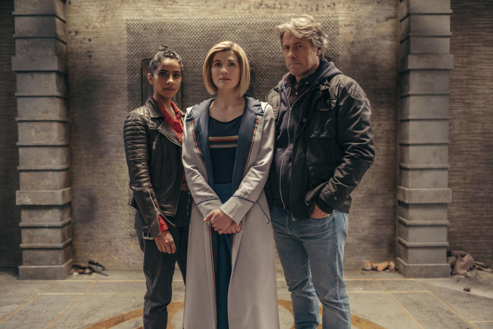 Jodie Whittaker (center, with Mandip Gill and John Bishop) will be stepping down as the Doctor. (Photo: BBC Studios/James Pardon)