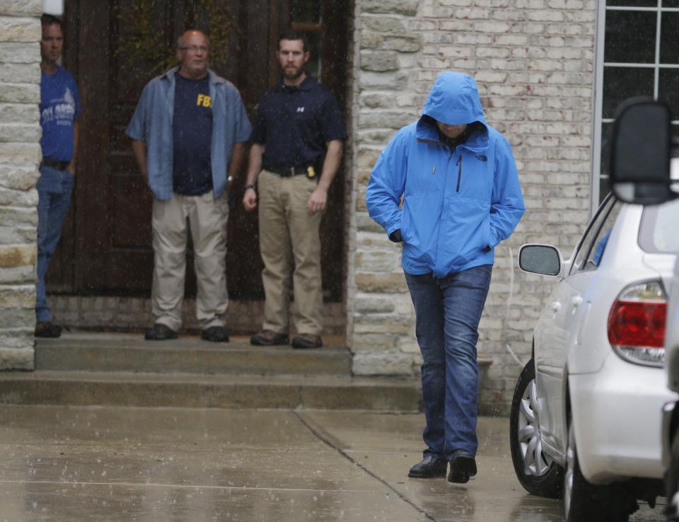 Subway restaurant spokesman Jared Fogle walks to a waiting car as he leaves his home on July 7 in Zionsville, Ind. FBI agents and Indiana State Police have removed electronics from the property. FBI Special agent Wendy Osborne said Tuesday that the FBI was conducting an investigation in the Zionsville area but wouldn't confirm it involved Fogle. (AP Photo/Michael Conroy)