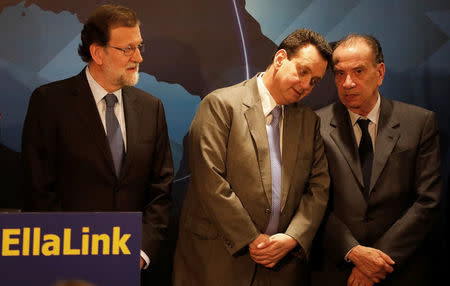 Spain's Prime Minister Mariano Rajoy looks at Brazil's Ministry of Science, Technology, Innovation and Communications Gilberto Kassab (C) and Brazil's Foreign Minister Aloysio Nunes (R) during the ceremony for the EllaLink undersea telecommunications cable between Brazil and Spain in Sao Paulo, Brazil, April 24, 2017. REUTERS/Nacho Doce