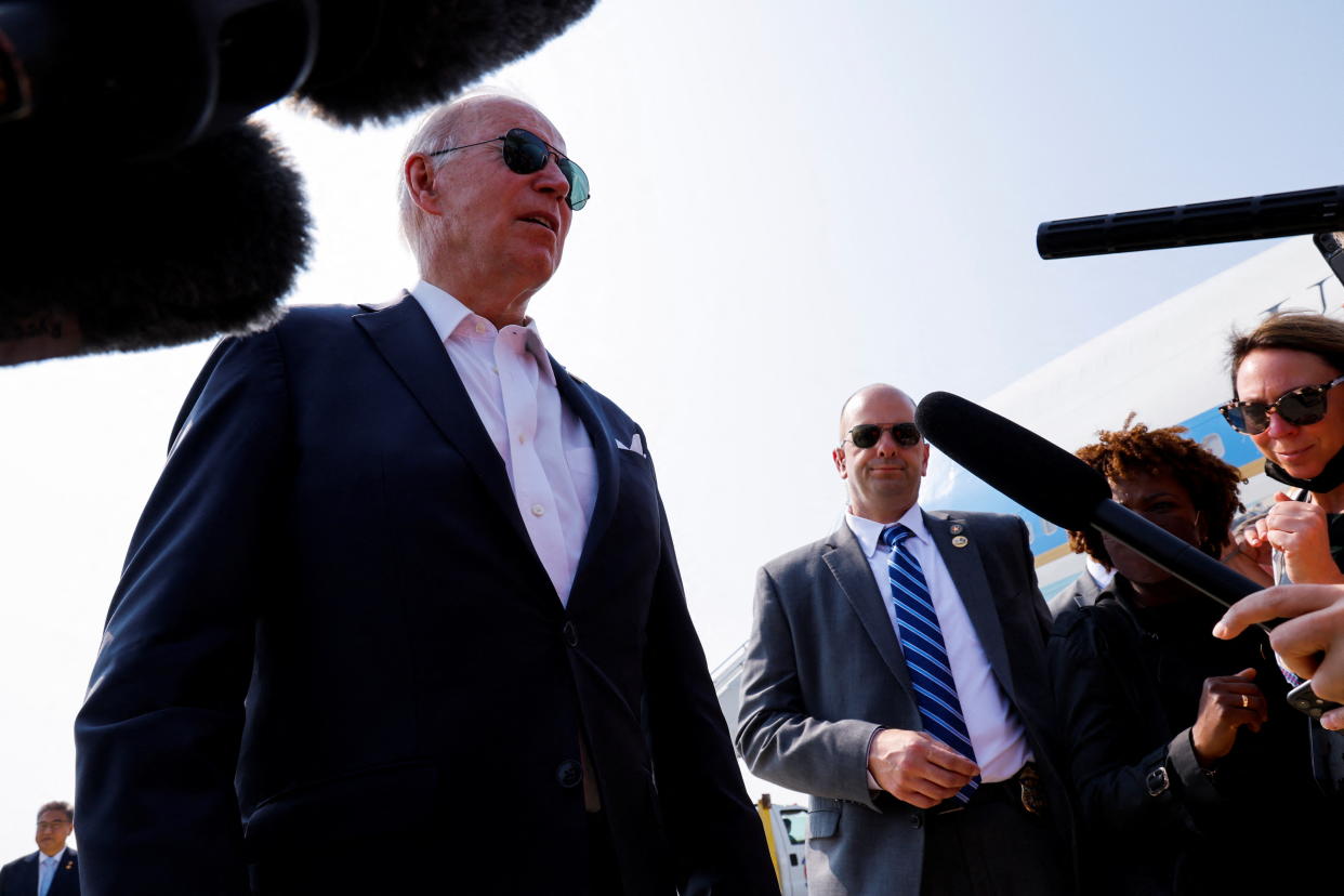 U.S. President Joe Biden speaks to the press before embarking on a plane from the Osan Air Base in Pyeongtaek, South Korea, May 22, 2022. REUTERS/Jonathan Ernst