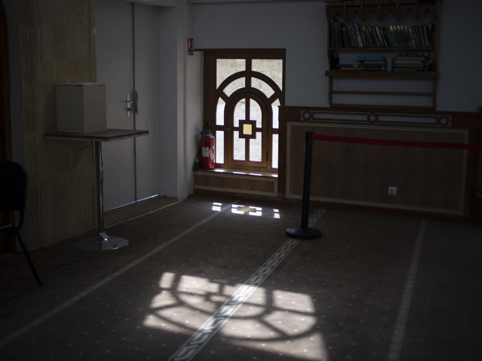 Sunlight shines through a window in the mosque at Ibn Khaldoun, a private Muslim school, in Marseille, southern France, Tuesday, April 16, 2024. (AP Photo/Daniel Cole)