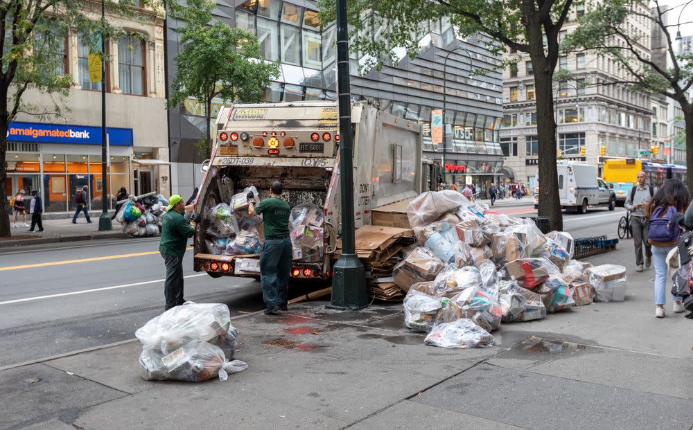 Department of Sanitation New York workers handle trash in Manhattan, New York.