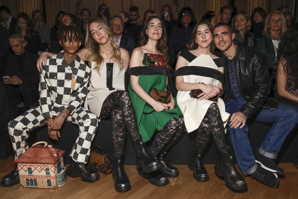 Jaden Smith, from left, Este Haim, Danielle Haim and Alana Haim attend the Louis Vuitton Fall/Winter 2023-2024 ready-to-wear collection presented Monday, March 6, 2023 in Paris. (Vianney Le Caer/Invision/AP)