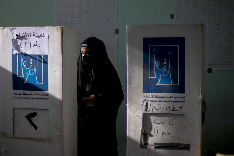 Iraqis vote during provincial elections in Najaf, Iraq, Monday, Dec. 18, 2023. (AP Photo/Anmar Khalil)