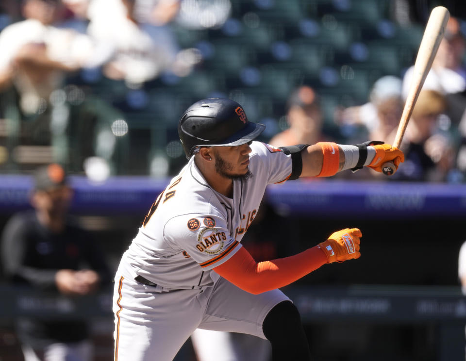 San Francisco Giants' Thairo Estrada singles against Colorado Rockies starting pitcher Brent Suter in the first inning of the first game of a baseball doubleheader, Saturday, Sept. 16, 2023. (AP Photo/David Zalubowski)