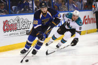 ST. LOUIS, MO - APRIL 21: Kevin Shattenkirk #22 of the St. Louis Blues controls the puck against Justin Braun #61 of the San Jose Sharks during Game Five of the Western Conference Quarterfinals during the 2012 NHL Stanley Cup Playoffs at the Scottrade Center on April 21, 2012 in St. Louis, Missouri. The Blues beat the Sharks 3-1 to advance to the Western Conference Semifinals. (Photo by Dilip Vishwanat/Getty Images)