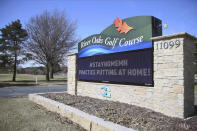 The River Oaks Golf Course marquee lets golfers know where it stands in the effort to help stop the spread of the coronavirus in Minnesota Wednesday, April 1, 2020 near Cottage Grove, Minn. The new coronavirus causes mild or moderate symptoms for most people, but for some, especially older adults and people with existing health problems, it can cause more severe illness or death. (AP Photo/Jim Mone)