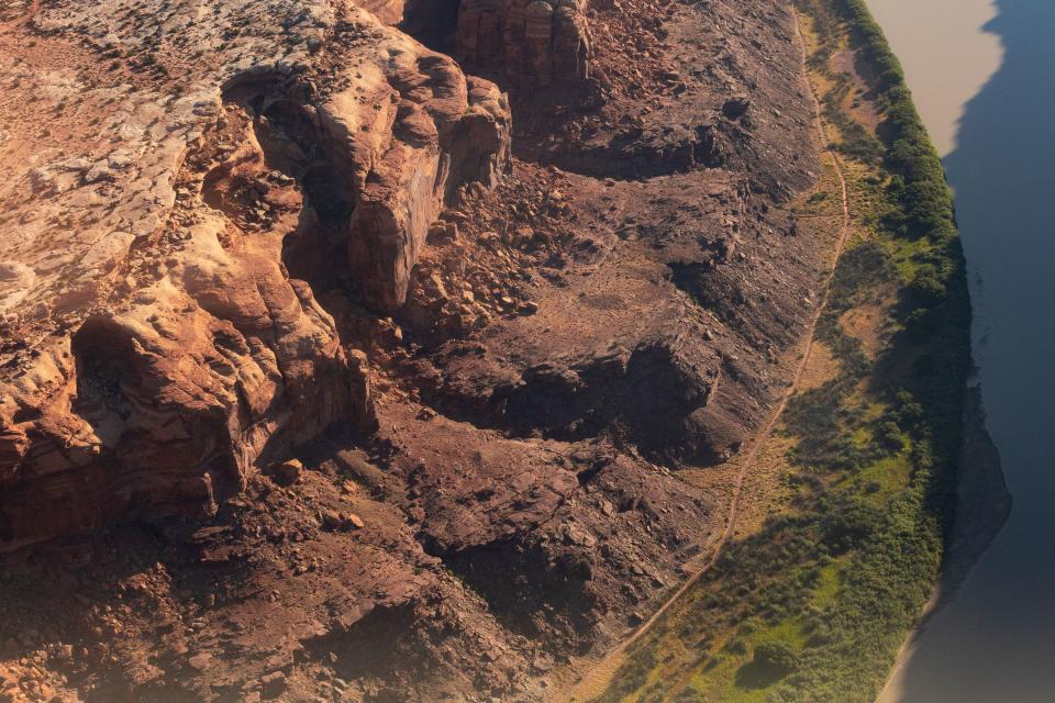 The Hey Joe Canyon trail, a narrow off-road trail that weaves along the bottom edge of Labyrinth Canyon and the Green River, as seen from an EcoFlight above one of the areas that will be impacted by the Labyrinth Canyon and Gemini Bridges Travel Plan on Friday, Sept. 22, 2023. The travel management plan from the Bureau of Land Management, which covers 300,00 acres near Moab, will be released by Sept. 30. | Megan Nielsen, Deseret News