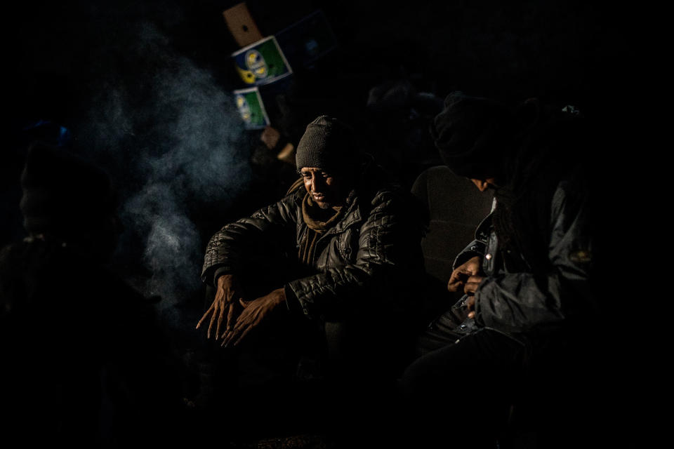 <p>A migrants from Pakistan is seen while warming him self up near a fire within an abandoned warehouse near the Central train station in Belgrade, Serbia, Wednesday, Feb. 2017. (Manu Brabo/MeMo) </p>