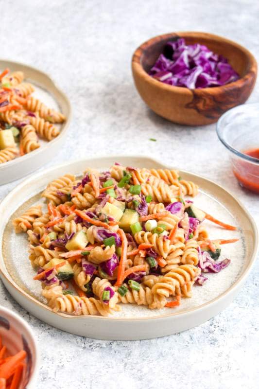 <p>Darn Good Veggies</p><p>Protein-packed Thai pasta salad is a healthy 20 minute dinner recipe that packs in over 18 grams of protein and is full of veggies!</p><p><strong>Get the recipe: <a href="https://www.darngoodveggies.com/protein-packed-thai-pasta-salad-vegan-gluten-free/" rel="nofollow noopener" target="_blank" data-ylk="slk:Chicken Caesar Pasta Salad;elm:context_link;itc:0;sec:content-canvas" class="link ">Chicken Caesar Pasta Salad</a></strong></p>
