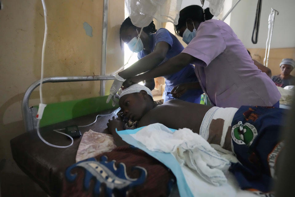 A victim of St. Francis Catholic Church attack receives treatment at St Louis Catholic Hospital in Owo Nigeria, Monday, June 6, 2022. Lawmakers in southwestern Nigeria say more than 50 people are feared dead after gunmen opened fire and detonated explosives at a church. Ogunmolasuyi Oluwole with the Ondo State House of Assembly said the gunmen targeted the St Francis Catholic Church in Ondo state on Sunday morning just as the worshippers gathered for the weekly Mass. (AP Photo/Sunday Alamba)