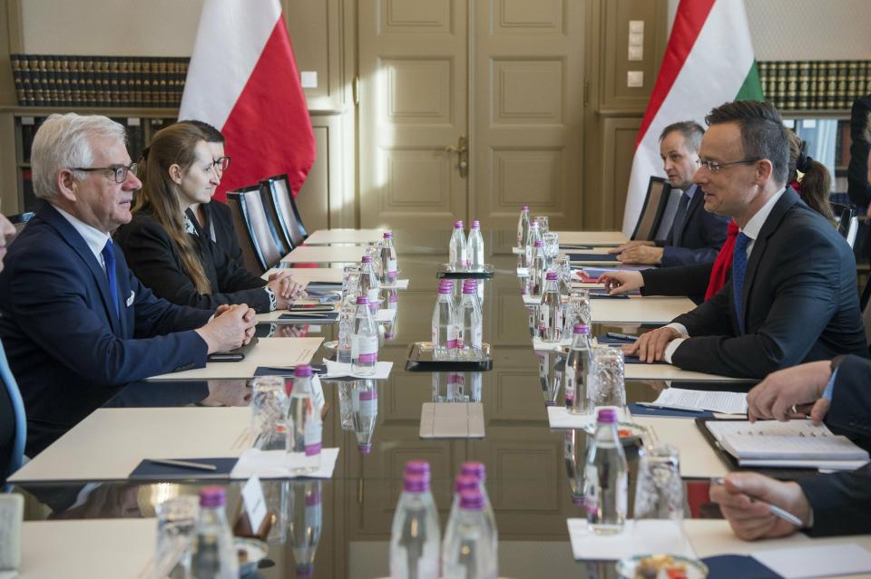 Hungarian Minister of Foreign Affairs and Trade Peter Szijjarto, right, and Polish Minister of Foreign Affairs Jacek Czaputowicz, left, attend a meeting at the Minister of Foreign Affairs and Trade in Budapest, Hungary, Wednesday, Feb. 27, 2019. (Zoltan Balogh/MTi via AP)