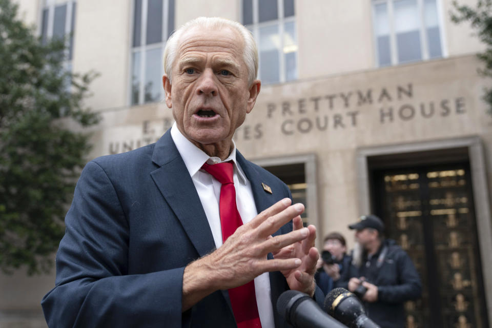 Former Trump White House official Peter Navarro talks to the media as he arrives at U.S. Federal Courthouse in Washington, Thursday, Jan. 25, 2024. (AP Photo/Jose Luis Magana)