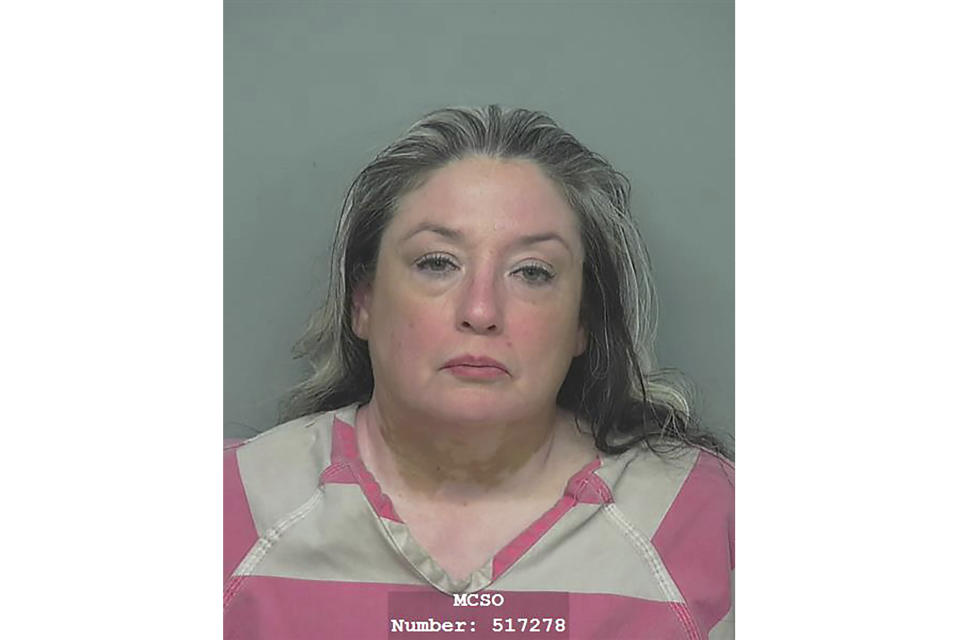 This Montgomery County Jail photo shows Divimara Lamar Nava. Montgomery County Sheriff Rand Henderson says 53-year-old Divimara Lamar Nava, wife of suspect Francisco Oropeza, was in custody in connection with the Friday night shooting in Cleveland, Texas. (Montgomery County Jail via AP)